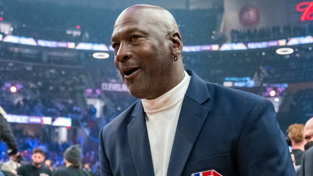 Michael Jordan smiling during a ceremony.